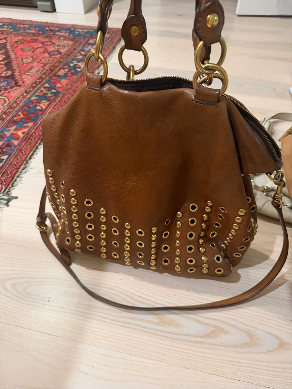 Miu Miu Studded Bow Hobo Bag in a rich Cognac / Chestnut Brown calfskin leather